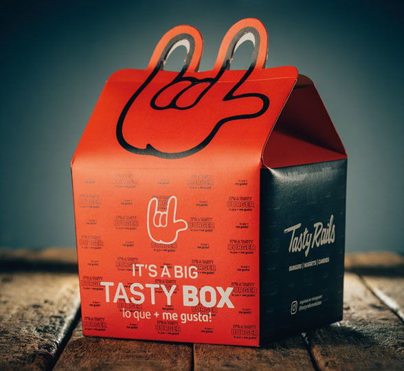 Tasty Box de Tasty Rolls, con asas troqueladas en forma de mano.